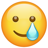 WhatsApp smiling face with tear